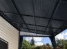 Pergola toit acier avec rideaux 11 m2