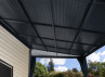 Pergola toit acier avec rideaux 13 m2